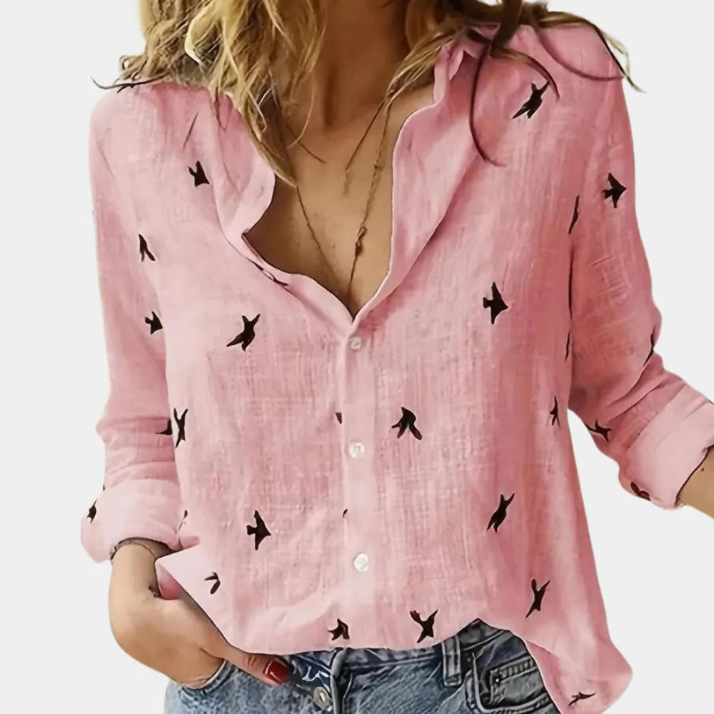 Women's long sleeve shirt by Belro, in soft fabric with a relaxed fit, shown in a neutral color on a hanger.