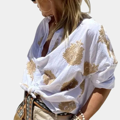 Belro women's blouse in soft fabric, featuring a classic collar, button-down front, and long sleeves, styled for casual wear.