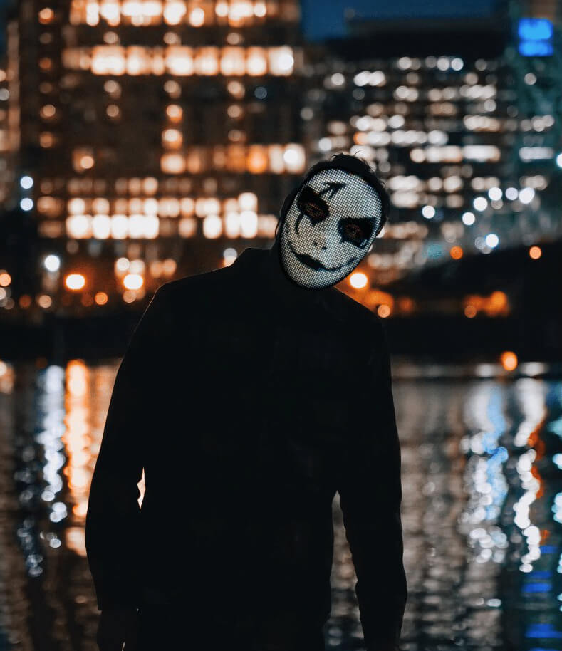 Belro LED Smart Mask with illuminated design, worn as a costume accessory, featuring vibrant light patterns on a fabric mask.