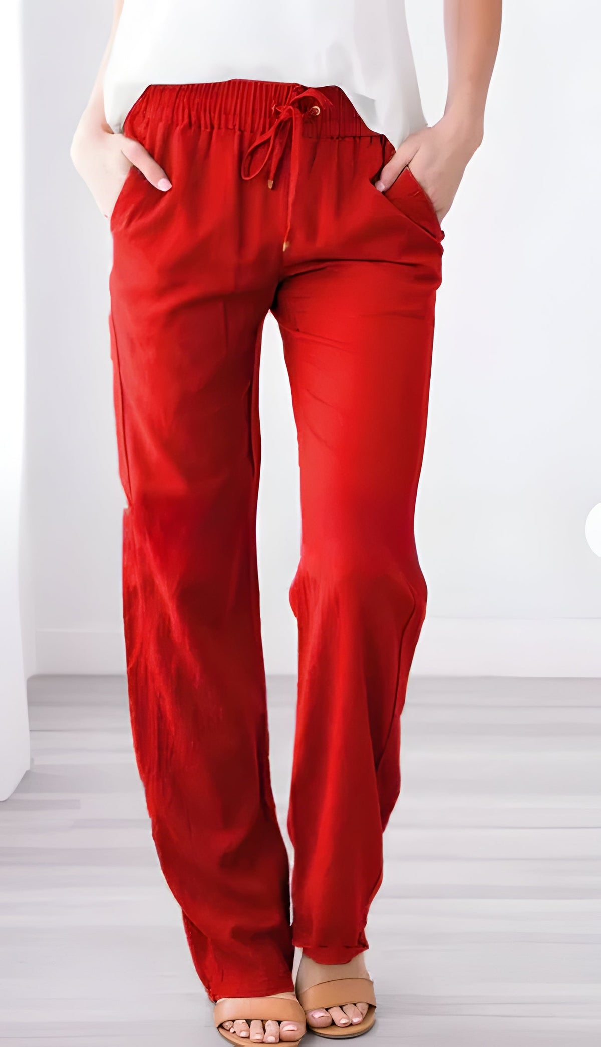 Belro summer trousers, stylish lightweight pants for warm weather, shown in a casual outdoor setting.