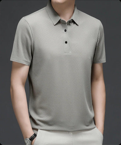 Men's Belro mesh polo shirt in lightweight, breathable fabric, shown in a close-up of the collar and textured mesh material.
