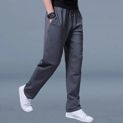 Men's Belro jogging pants in black with side pockets, made from comfortable athletic fabric, suitable for casual or workout wear.