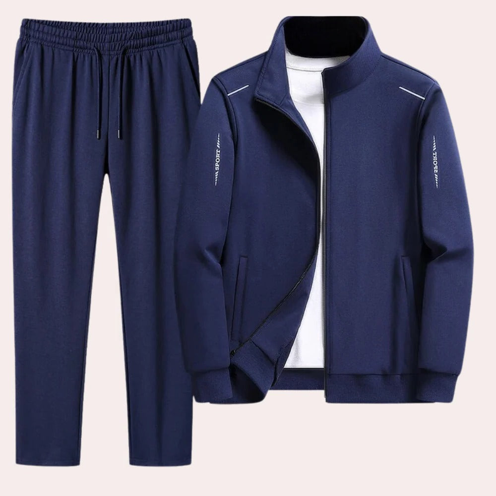 Comfortable men's Belro tracksuit in navy blue, featuring a zip-up jacket and matching joggers, ideal for active wear and casual outings.