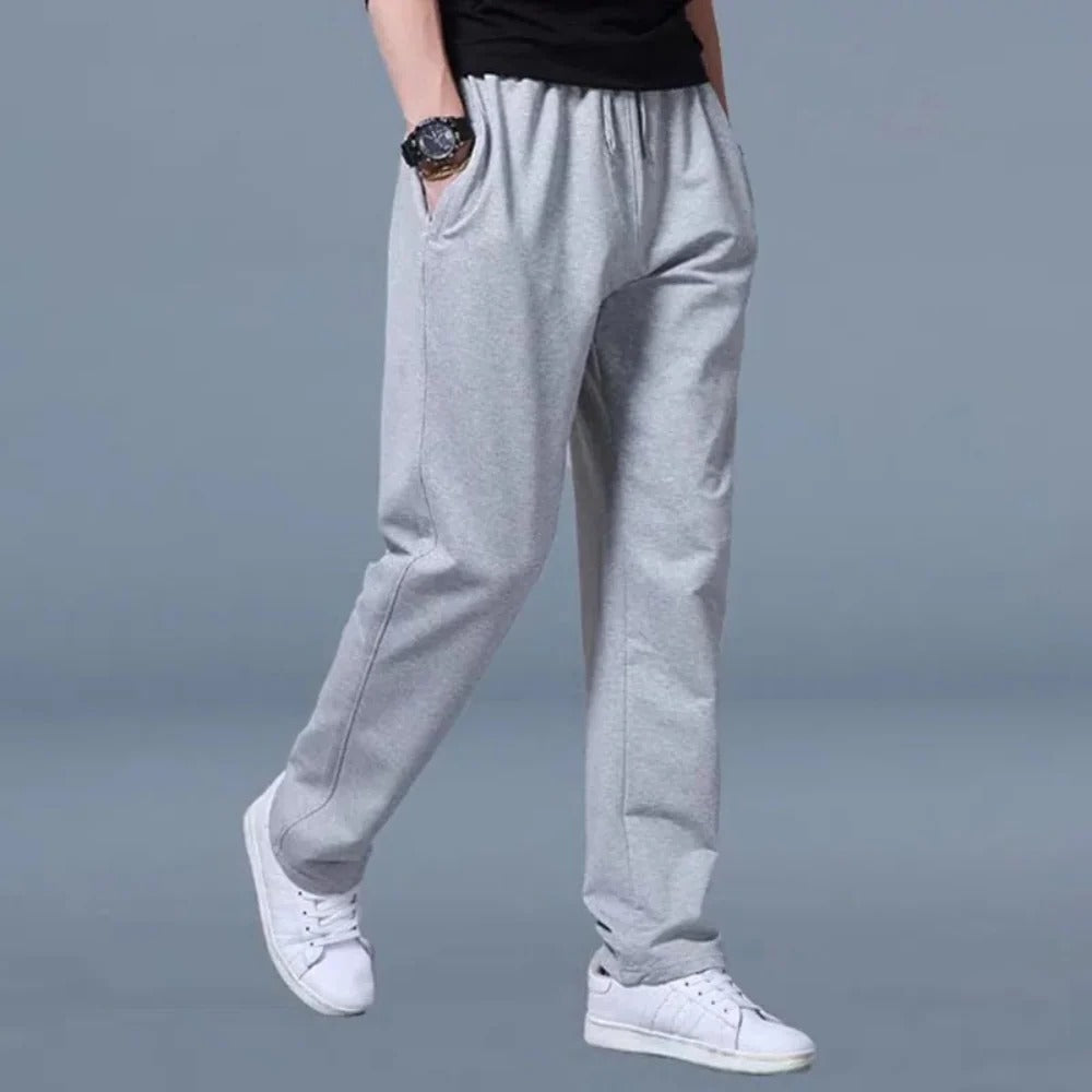 Belro men's jogging pants in black, featuring elastic waistband and relaxed fit, suitable for casual and athletic wear.