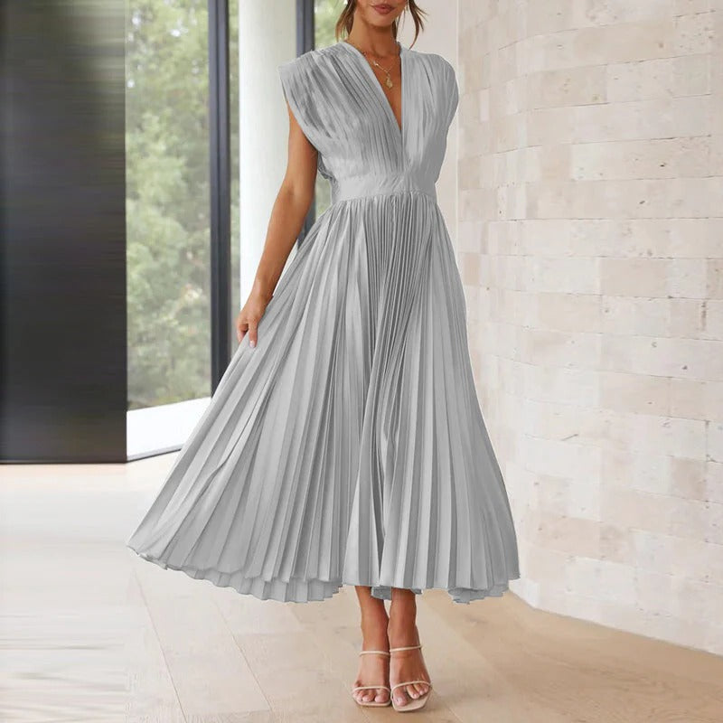 Belro V-neck dress in soft fabric, featuring a flattering V-neckline and a flowing silhouette, perfect for casual or dressy occasions.