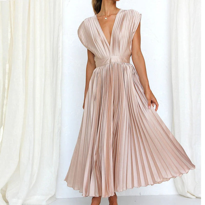 Belro V-neck dress in soft fabric, stylishly draped with long sleeves and a flattering fit, perfect for casual or semi-formal wear.