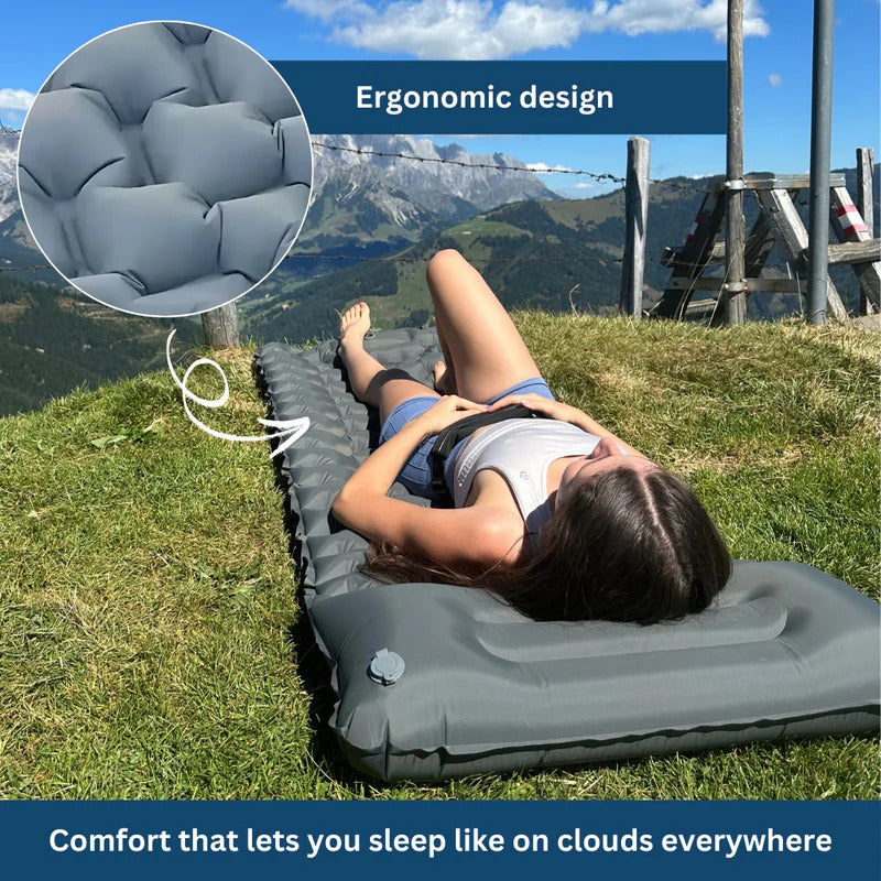 Belro ultralight and compact sleeping pad for outdoor camping, shown rolled out in a natural outdoor setting.