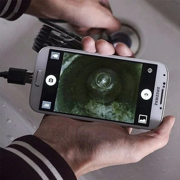 Wireless waterproof endoscope camera by Belro shown connected to an iPhone with a flexible cable and camera head visible.