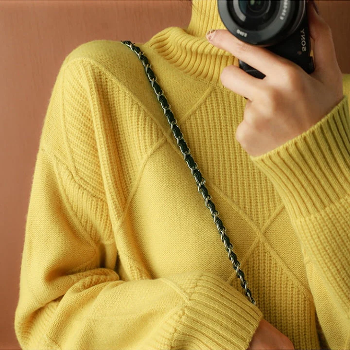 Belro knitted sweater featuring a cozy, textured knit pattern in soft, neutral tones, perfect for casual or layered wear.