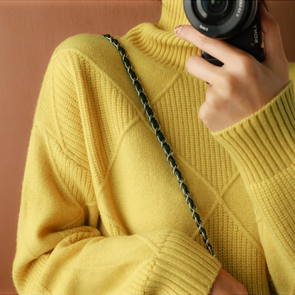 Belro knitted sweater featuring a cozy, textured knit pattern in soft, neutral tones, perfect for casual or layered wear.