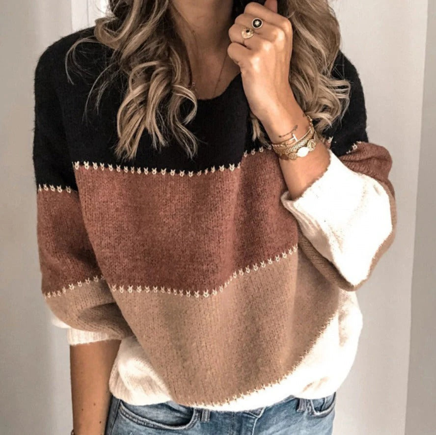 Belro striped cashmere sweater featuring multicolor horizontal stripes, soft and cozy knit fabric, close-up of the sweater's pattern.