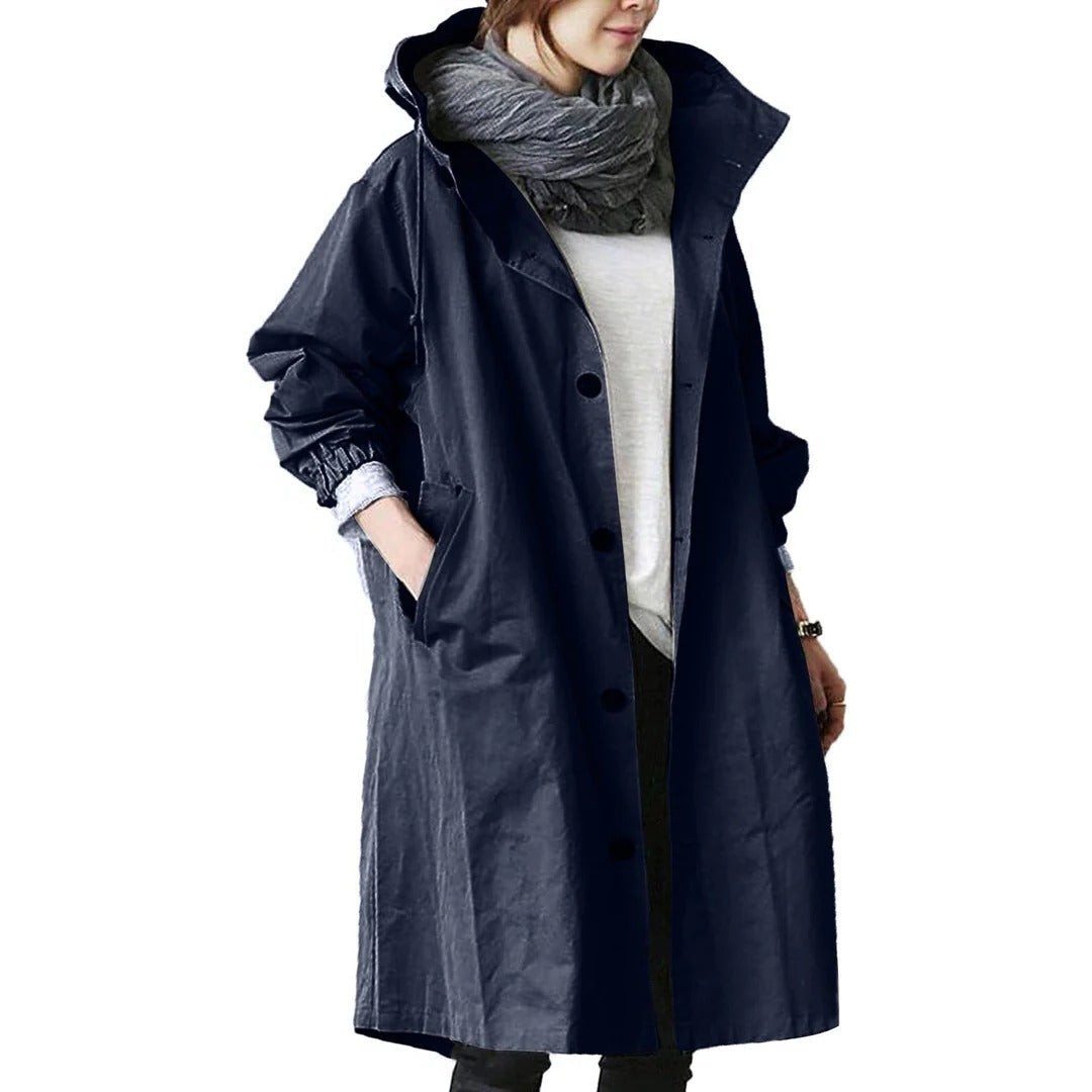 Women's long waterproof raincoat by Belro, shown in a sleek design with a hood and rain-resistant fabric for protection against the weather.