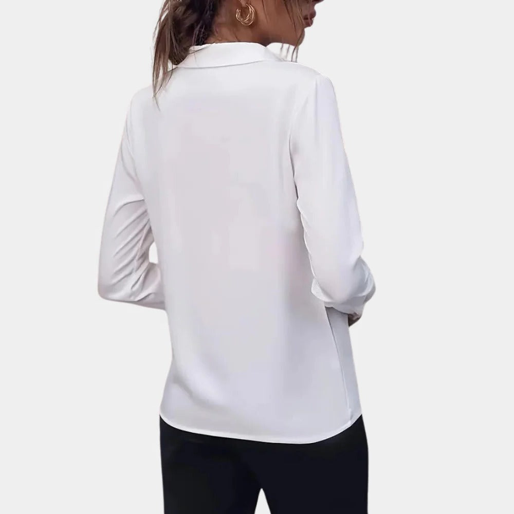 Elegant plain ladies blouse by Belro, showcasing a soft fabric and classic design, suitable for casual or formal wear.