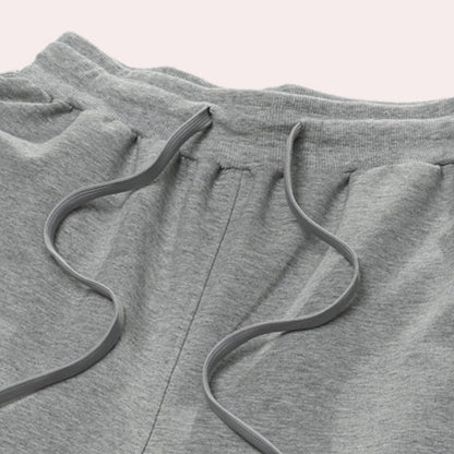 Men's Belro jogging pants in black, made from comfortable athletic fabric, featuring an elastic waistband and relaxed fit.