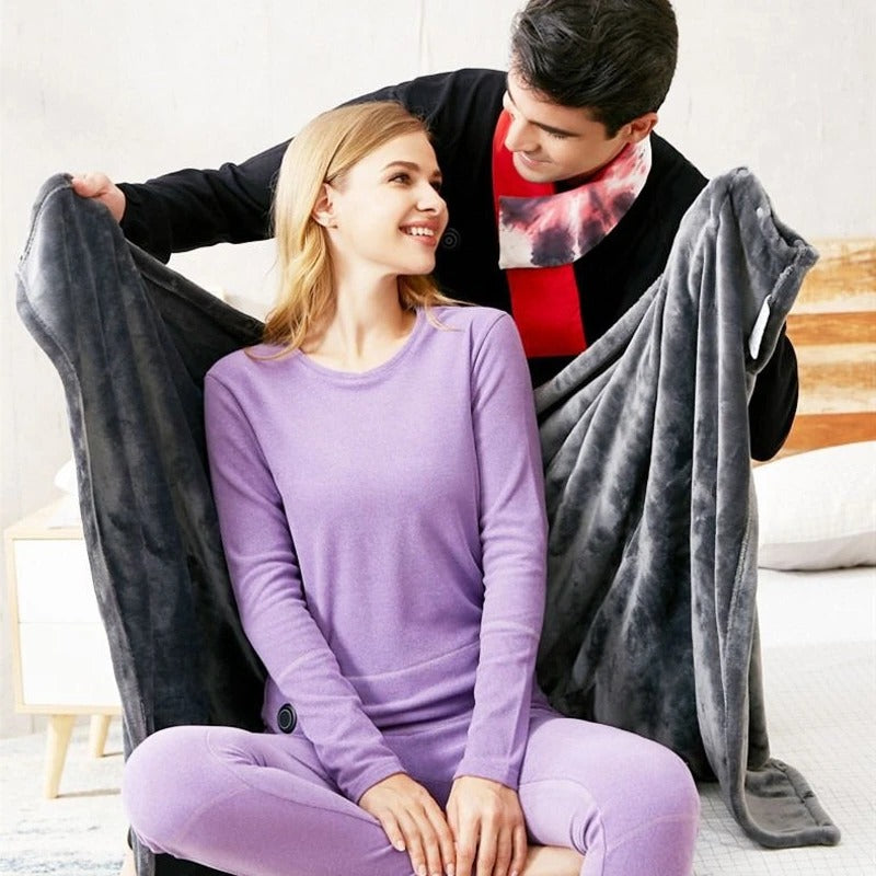Belro USB electric heated blanket draped over a cozy bed, showcasing soft fabric and integrated heating control for warmth.