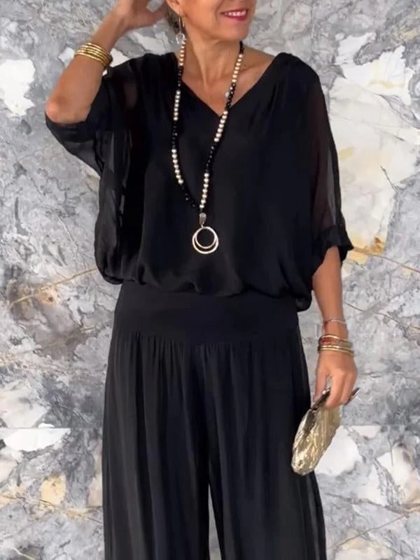 Elegant two-piece wide-leg chiffon pants from Belro, showcasing flowy fabric and stylish design in a natural pose.