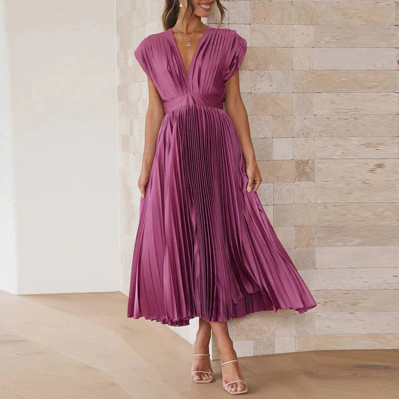 Belro V-neck dress featuring a flowy fabric and elegant design, perfect for casual or semi-formal occasions.