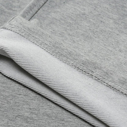 Men's Belro jogging pants in black, made of comfortable fabric, displayed folded with elastic waistband and side pockets.