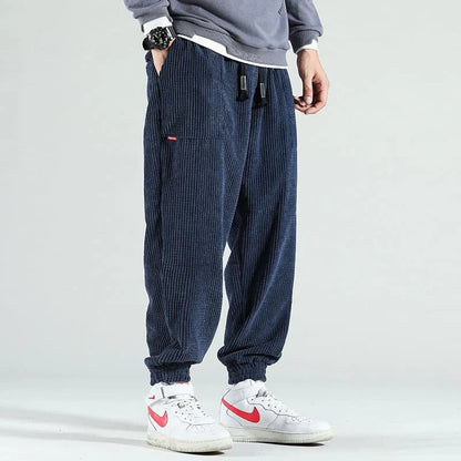 Belro corduroy trousers for women, showing a close-up of the textured fabric and classic fit in a neutral color.