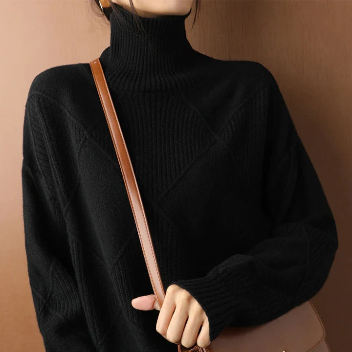 Belro knitted sweater, cozy long-sleeve clothing with a textured knit pattern, in a neutral color, displayed on a hanger.