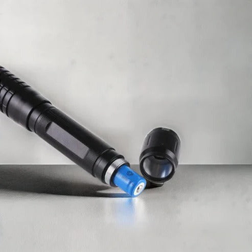 Belro Tactical Laser Torch featuring a sleek black flashlight with laser aiming module and textured grip for outdoor use.