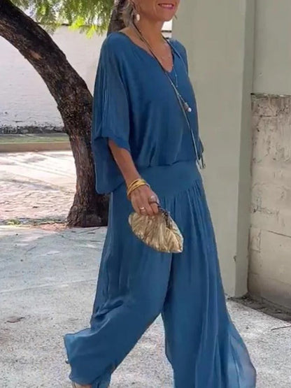 Belro elegant two-piece wide-leg chiffon pants set, featuring flowy fabric and stylish design, displayed on a hanger.