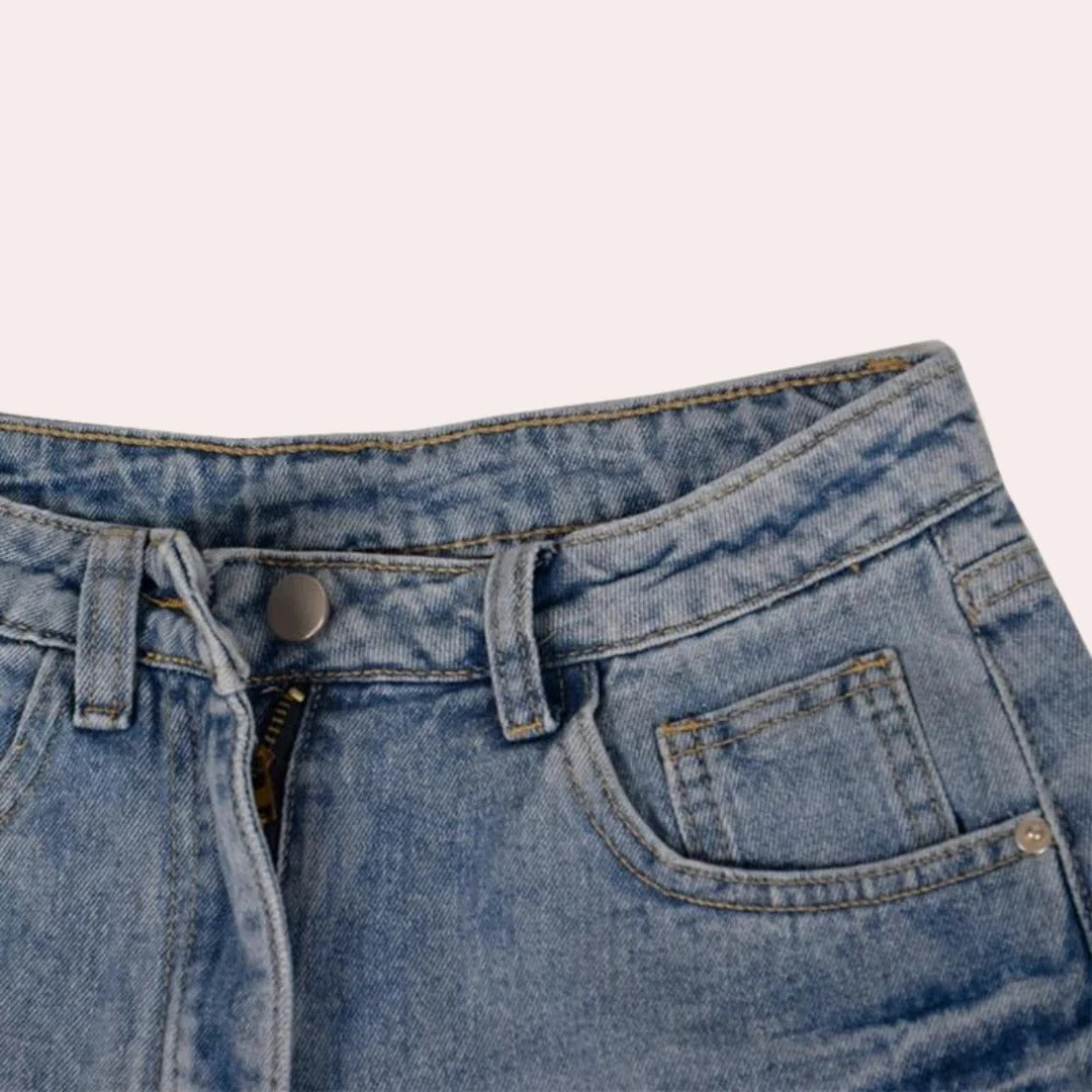 Belro trendy denim shorts for women featuring a casual fit and distressed details, shown on a model.