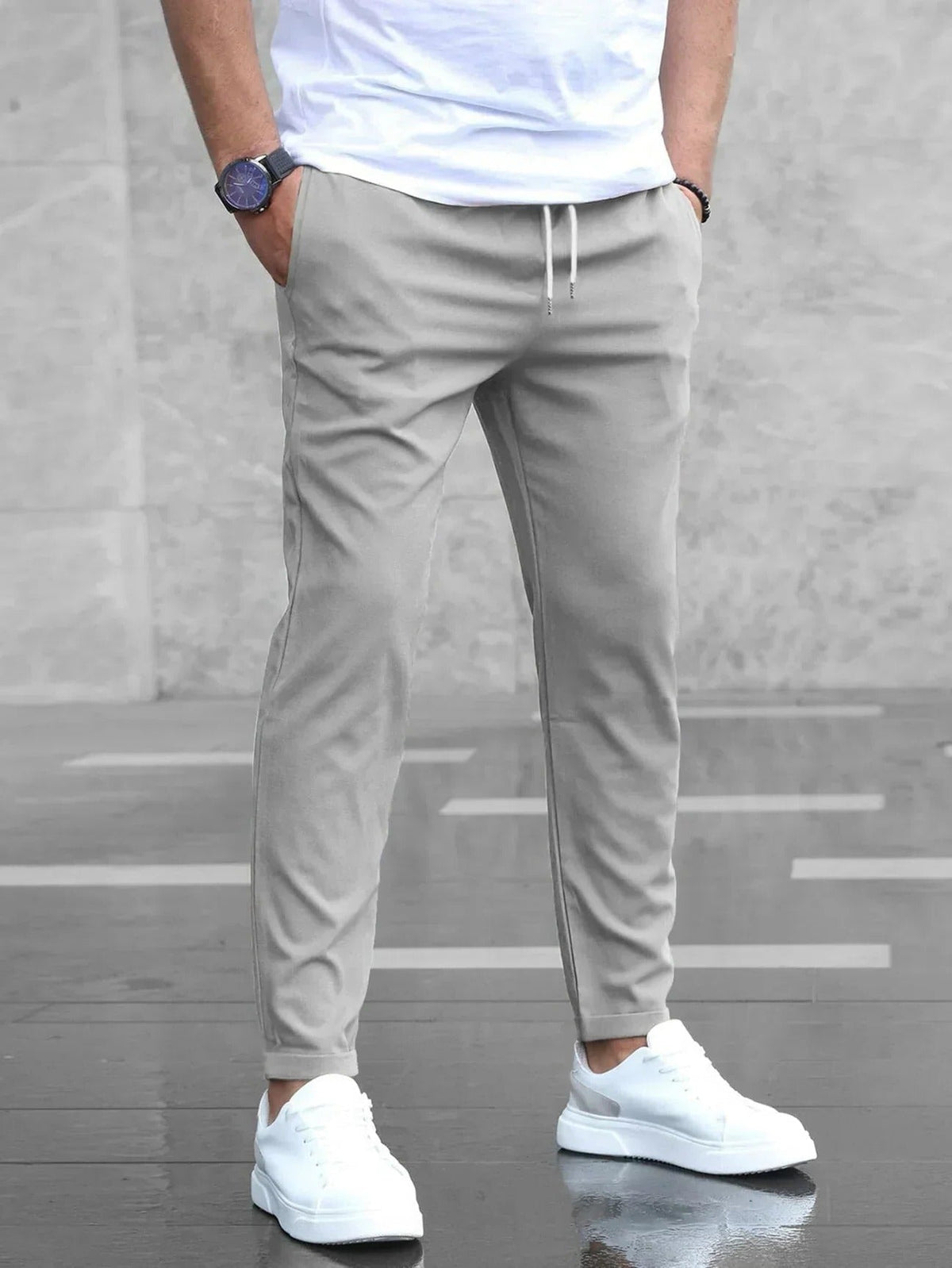 Men's Belro stretch pants in a neutral color, tailored fit, with visible waistband and front pockets, perfect for casual wear