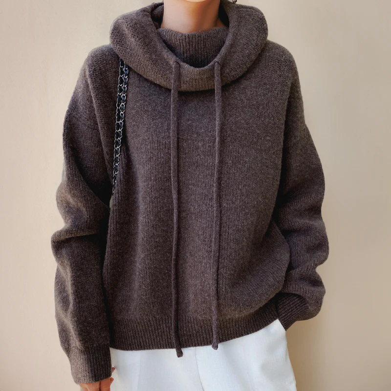 Belro women's merino wool turtleneck sweater in neutral color, close-up of soft, cozy knit fabric.