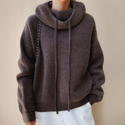 Belro women's merino wool turtleneck sweater in neutral color, close-up of soft, cozy knit fabric.
