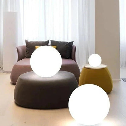 Wireless weatherproof outdoor globe light by Belro, 16-color LED sphere with umbrella accessories, illuminated and vibrant.