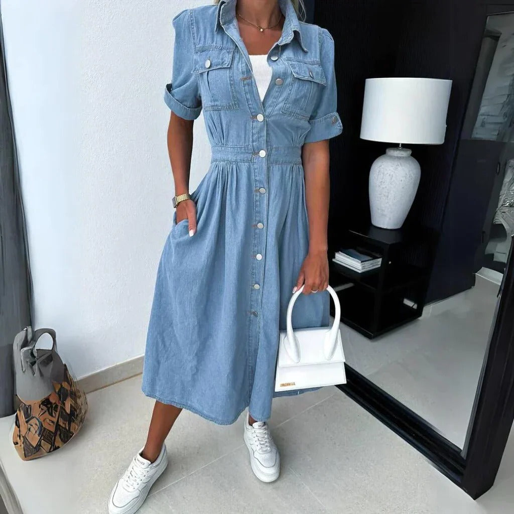 Belro trendy denim dress displayed on a hanger, featuring a casual fit with front pockets and adjustable straps.