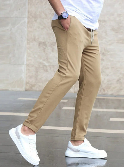 Men's Belro stretch pants in a relaxed fit, showing the front view with waistband and pockets, casual and comfortable clothing.