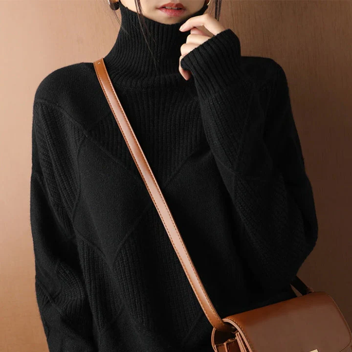 Belro knitted sweater in cozy wool, featuring a ribbed collar and cuffs, displayed on a hanger against a neutral background.