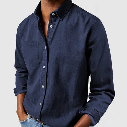 Light blue Belro cotton shirt with long sleeves and button-down front, displayed on a hanger.