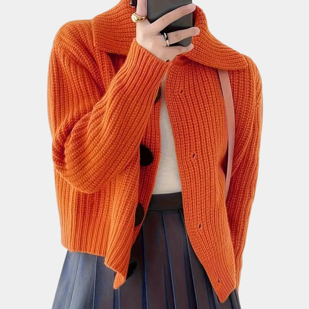 Elegant ladies cardigan by Belro, displayed on a mannequin with detailed knit fabric and classic design.
