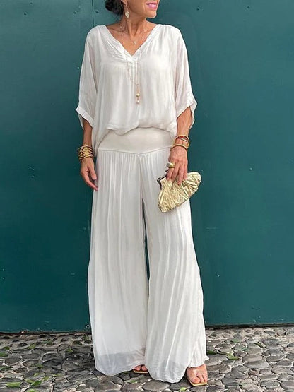 Elegant Belro two-piece wide-leg chiffon pants set with flowing fabric and stylish design, perfect for sophisticated casual wear.