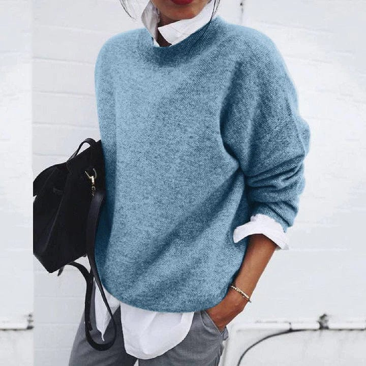 Belro soft cashmere sweater in a cozy knit, displayed on a hanger with a neutral background, highlighting the luxurious fabric.