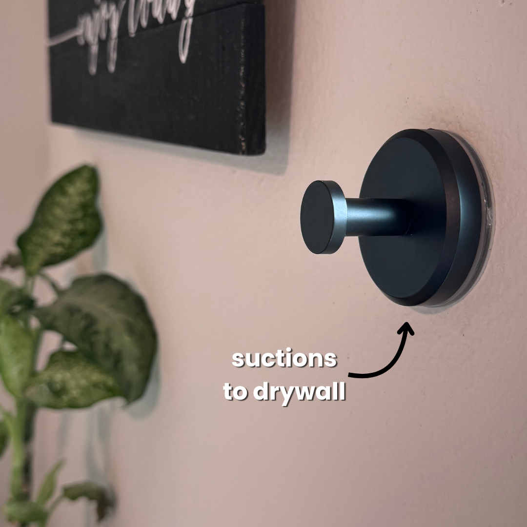 Belro Instant Grip Suction Hooks attached to a smooth bathroom tile, ideal for organizing towels and accessories.