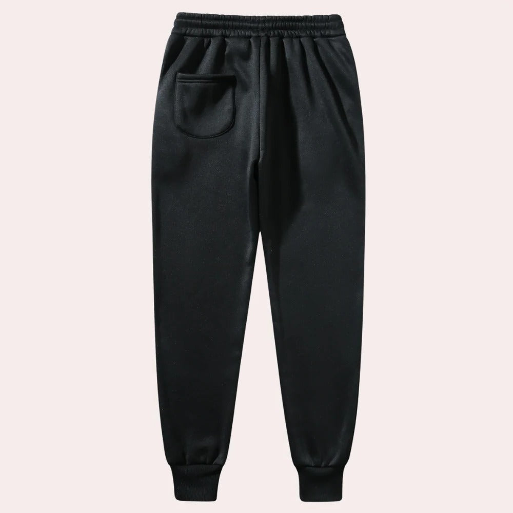 Belro men's jogging pants in black, made of breathable fabric, featuring an elastic waistband and side pockets for activewear comfort.
