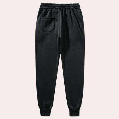 Belro men's jogging pants in black, made of breathable fabric, featuring an elastic waistband and side pockets for activewear comfort.