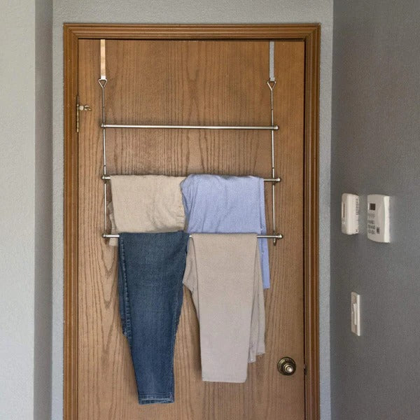 Belro over-the-door bathroom towel bar rack holder mounted on door, metal finish, for convenient towel storage in home bathroom.
