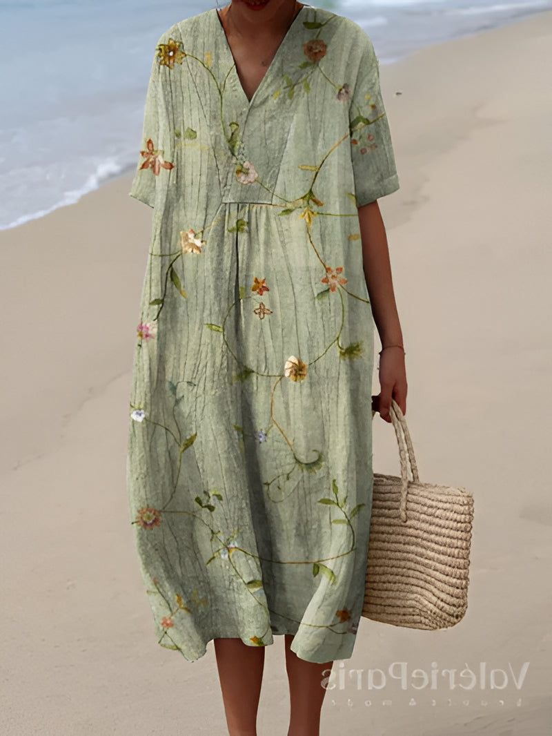 Belro summer dress featuring a flowy, floral design perfect for warm weather, displayed on a hanger against a neutral background.