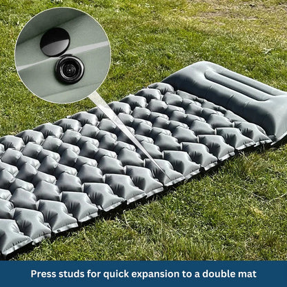 Belro ultralight and compact sleeping pad for outdoor camping, shown rolled out on a grassy surface.