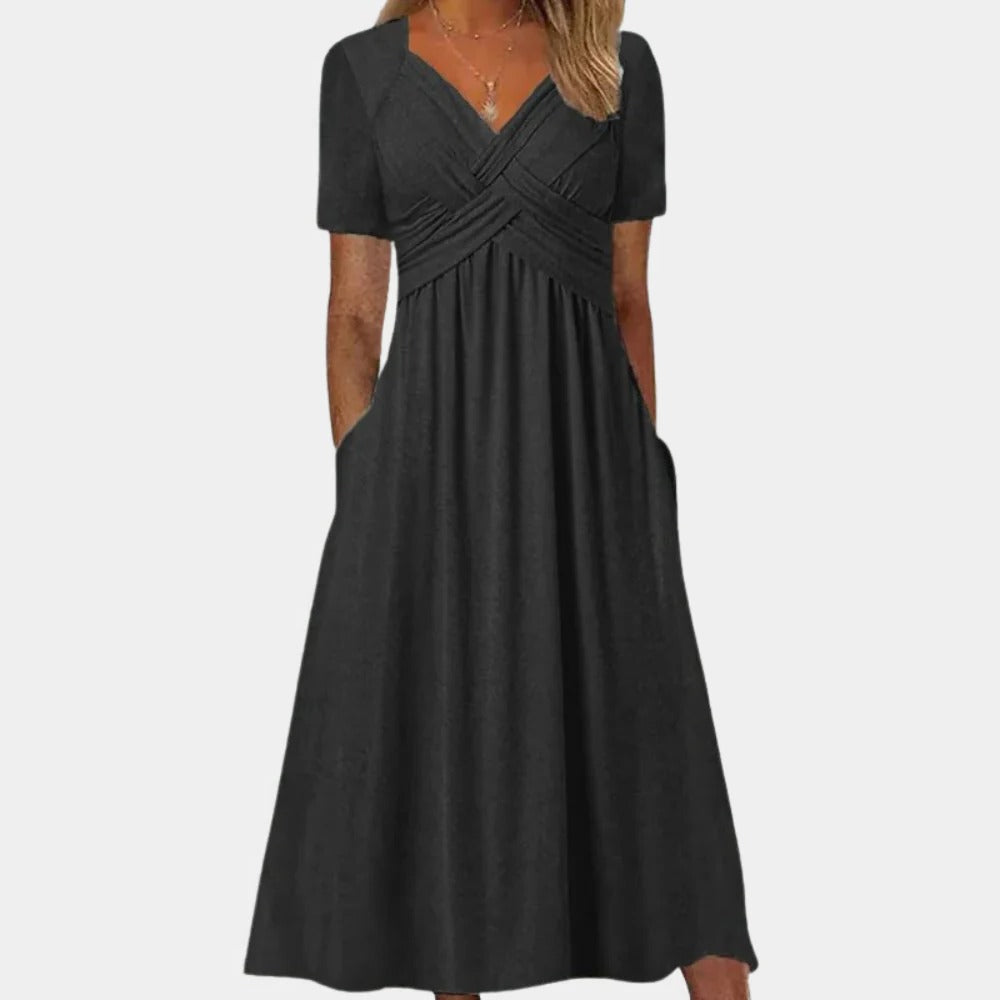 Elegant ladies summer dress with V-neck from Belro, shown in a flowy fabric and stylish design for warm weather.