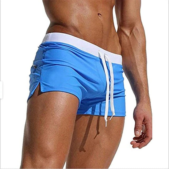 Men's Belro quick-drying swim trunks with a vibrant blue and black pattern, suitable for beach or pool swimming.