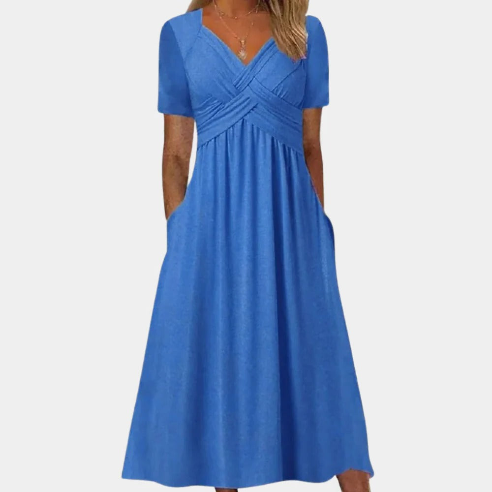 Elegant ladies summer dress with V-neck by Belro, featuring lightweight fabric and stylish design for warm weather wear.