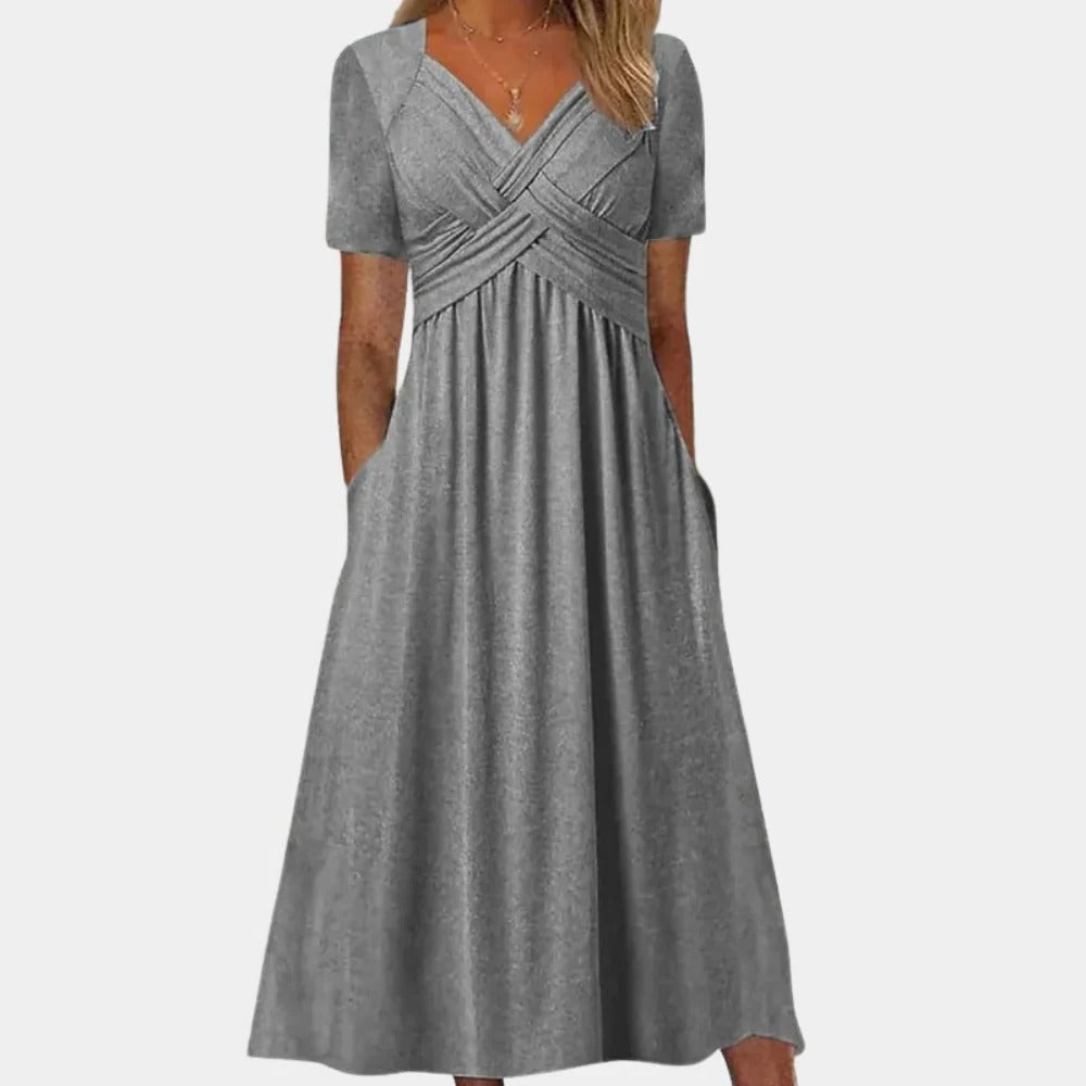 Elegant ladies summer dress with V-neck from Belro, featuring a flowing fabric and stylish design suitable for warm weather.