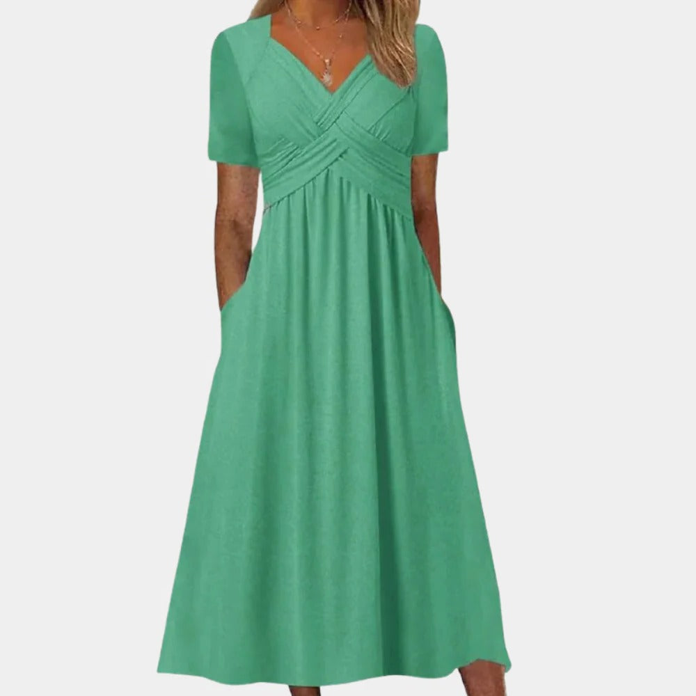 Elegant ladies summer dress with V-neck by Belro, featuring flowy fabric and stylish design perfect for warm weather.