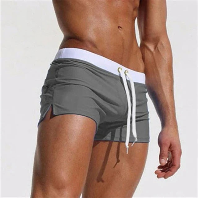 Belro men's quick-drying swim trunks in vibrant blue with a drawstring waist and elastic waistband, perfect for beach or pool.